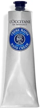 
A silver tube of L'Occitane hand cream featuring a blue label that highlights 20% shea butter for dry skin.