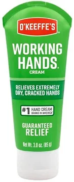 A three ounce green tube of O'Keeffe's Working Hands cream, labeled for relief of dry, cracked hands.